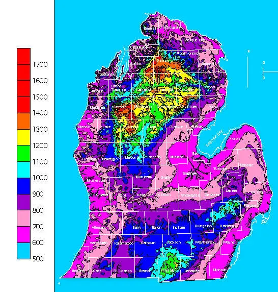 Map of Michigan showing annual snowfall in varying colors, ranging from 500mm to 1700mm. A valuable tool for earth research courses, this map includes a scale on the left for easy interpretation.